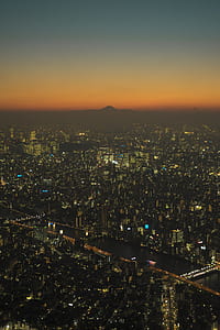aerial view of city buildings during nighttime thumbnail