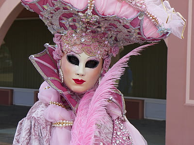 person wearing pink masquerade costume thumbnail