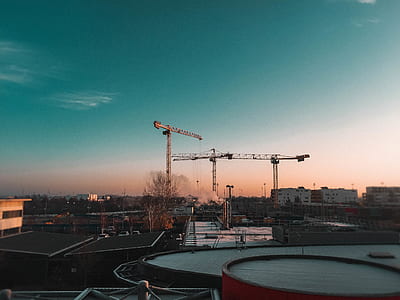 aerial photo of gray crane and buildings thumbnail