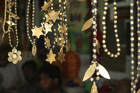 shallow focus photography of gold hanging decors thumbnail