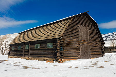 brown shack surrounded by snowfield thumbnail