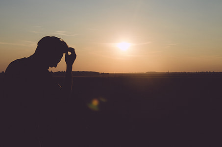 silhouette of man holding his hair thumbnail