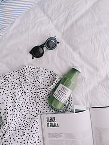Black Framed Black Lens Sunglasses With White and Black Dotted Button-up Shirt on White Textile thumbnail