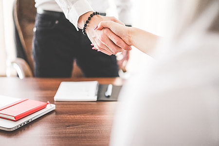Business Man and Woman Handshake in Work Office thumbnail
