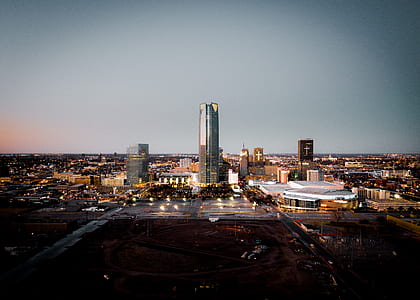 aerial photography of high rise buildings under gray sky thumbnail