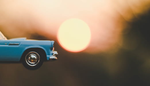 boke photography of blue die-cast model car thumbnail