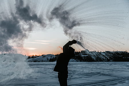 silhouette of person throwing water thumbnail