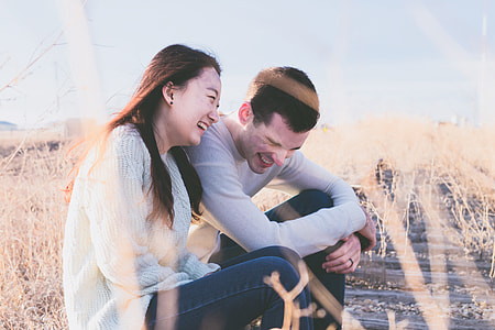 man and woman sitting beside each other thumbnail