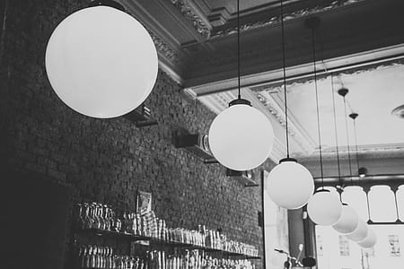 grayscale photo of pendant lamps thumbnail