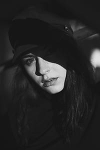 grayscale photo of woman with hat thumbnail