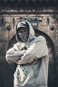 man crosshand wearing gray popeye-printed pullover hoodie thumbnail