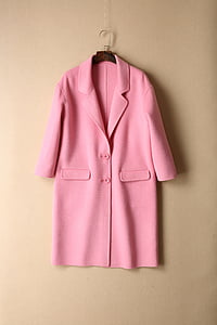 hanging pink coat on hanger thumbnail