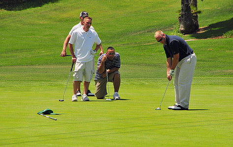 four man playing golf during daytime thumbnail