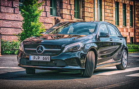 black Mercedes-Benz C-Class sedan on road during daytime thumbnail