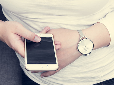 closeup photo of man holding gold iPhone 6 thumbnail