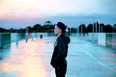 man standing on concrete flooring thumbnail