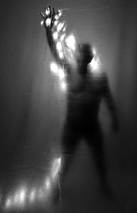 grayscale photo of person raising hand thumbnail