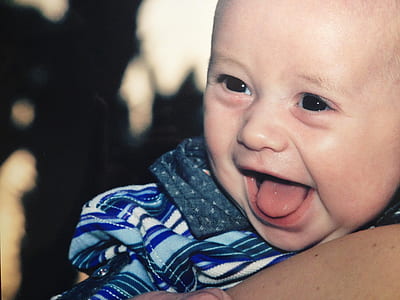 person carrying smiling baby thumbnail