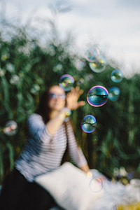 Having fun with soap bubbles in the nature thumbnail