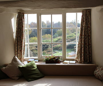 opened window curtain during daytime thumbnail