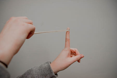 person holding rubber band thumbnail