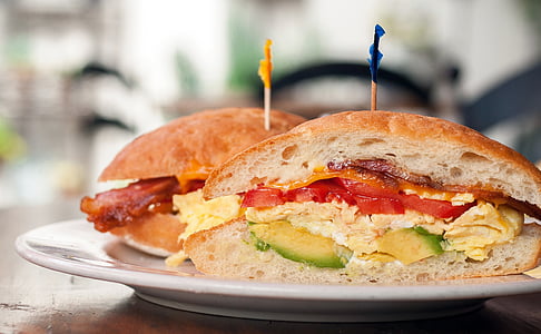 two avocado, egg, and tomato sandwiches thumbnail