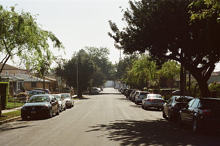 photography of cars parked on concrete road thumbnail