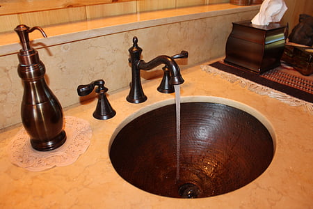 black faucet on white and black vanity top with thumbnail