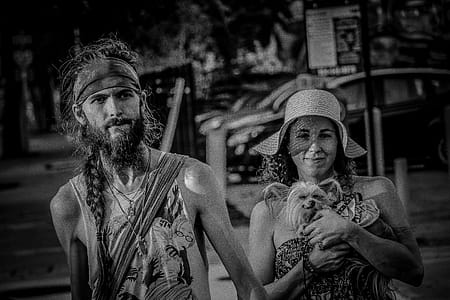 Grayscale Photo Of Couple With Small Dog thumbnail