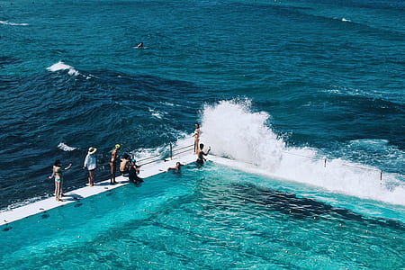 infinity pool raged by sea waves thumbnail
