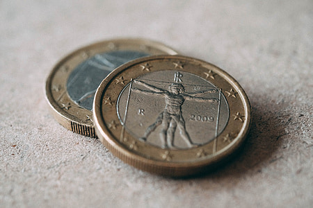 selective focus photography of coins on gray surface thumbnail