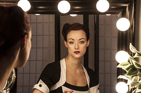 reflection of woman on mirror thumbnail