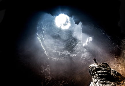 gray concrete boulder below hole thumbnail