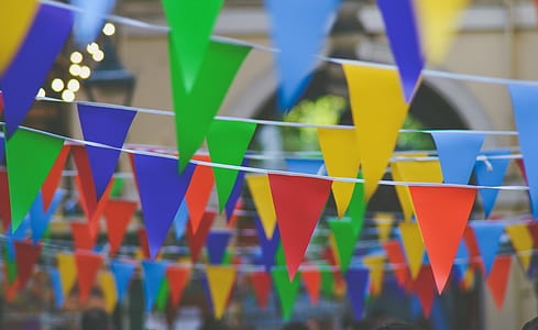 selective photography of multicolored pennants thumbnail