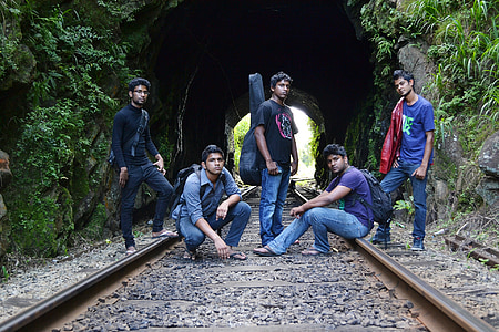 group of man taking photo on train rails thumbnail
