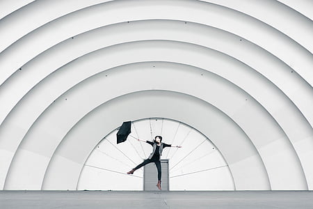 person holding black umbrella thumbnail