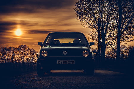 Volkswagen car on road during golden hour thumbnail