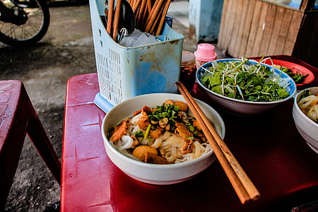chop sticks on top of food bowl thumbnail