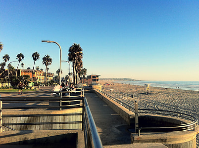 man walking near seashore at daytime thumbnail