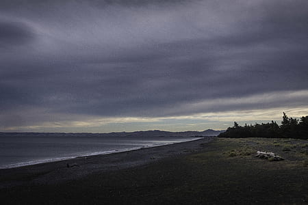 seashore under black clouds thumbnail