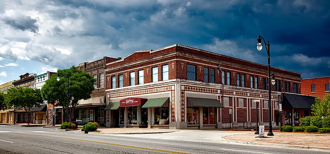 white and red concrete 2-storey building at daytime thumbnail