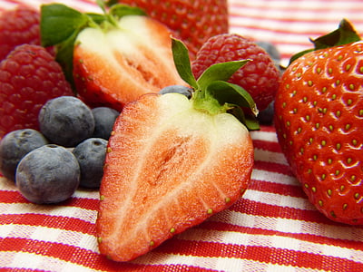 closeup photo of pile of strawberries and blueberries thumbnail