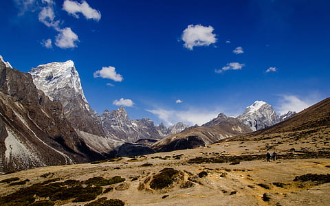 snow covered mountain under blue sky at daytime thumbnail