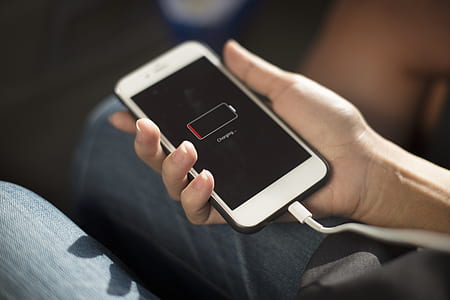 person holding low battery smartphone thumbnail