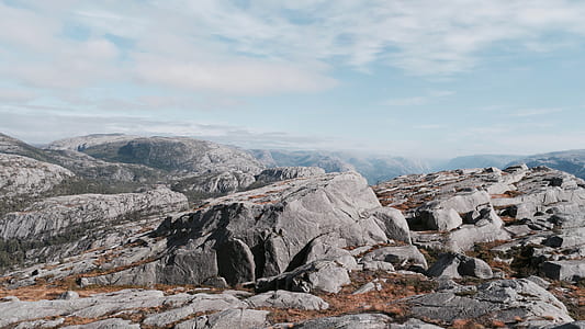 rock formation mountains under white sky thumbnail