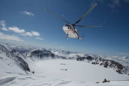 white helicopter under clear under the sky thumbnail