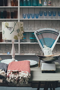 white and green table lamp on table thumbnail