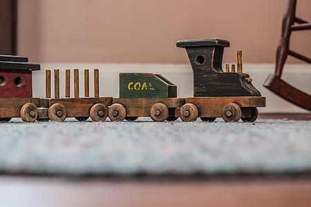photo of brown and black miniature wooden toy train thumbnail