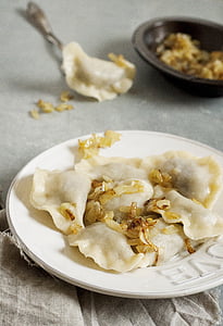 steamed dumplings on plate thumbnail