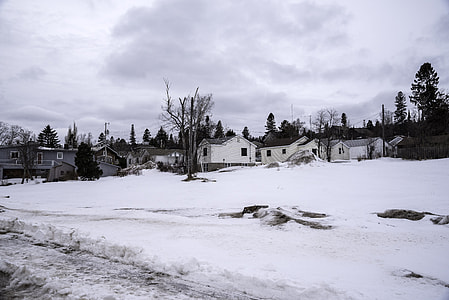 Houses and village in the snow in Grand Marais, Minnesota thumbnail